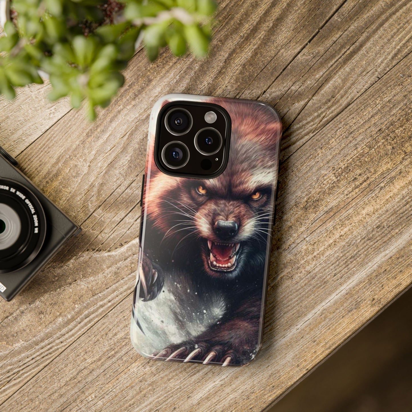 Wolverine snarling with claws out on a phone case.