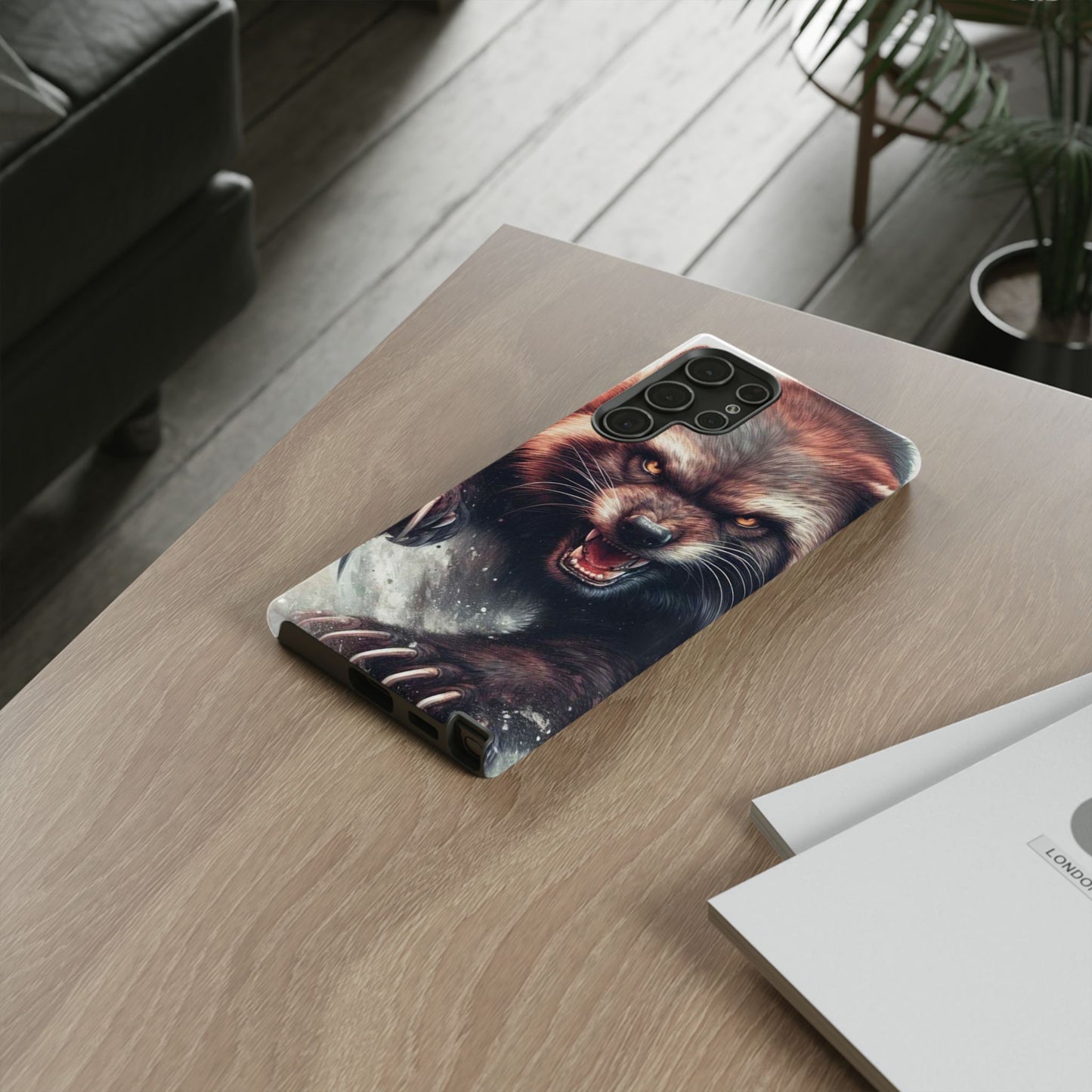 Wolverine snarling with claws out on a phone case.