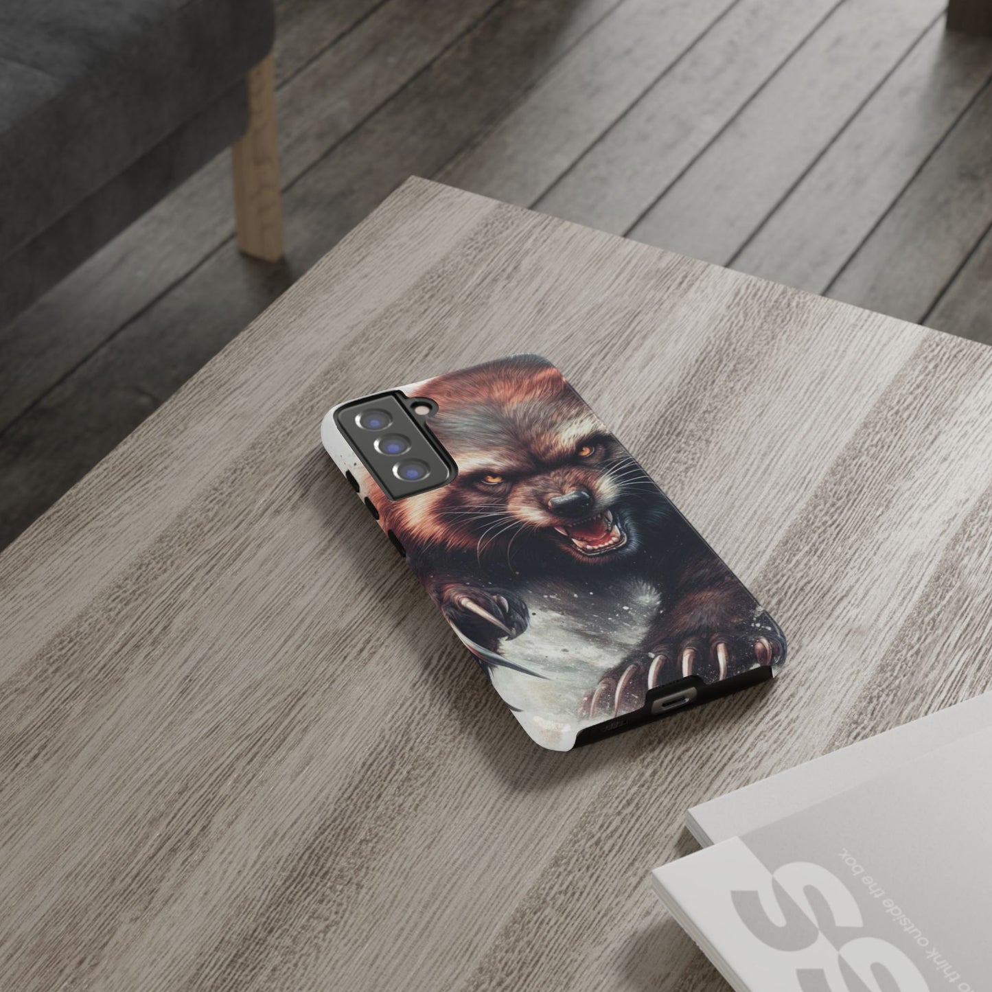 Wolverine snarling with claws out on a phone case.