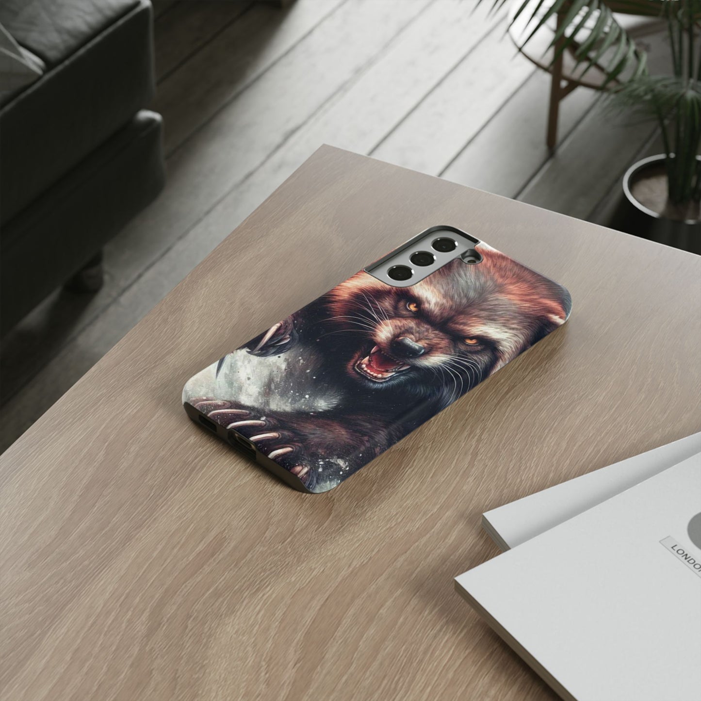 Wolverine snarling with claws out on a phone case.