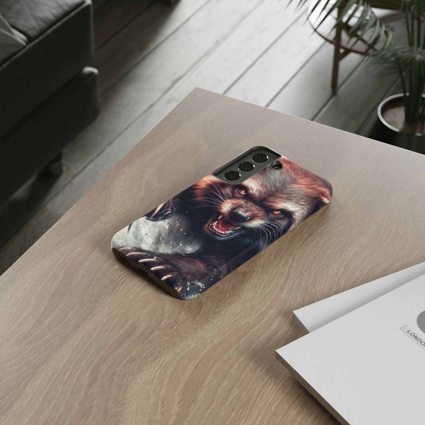 Wolverine snarling with claws out on a phone case.