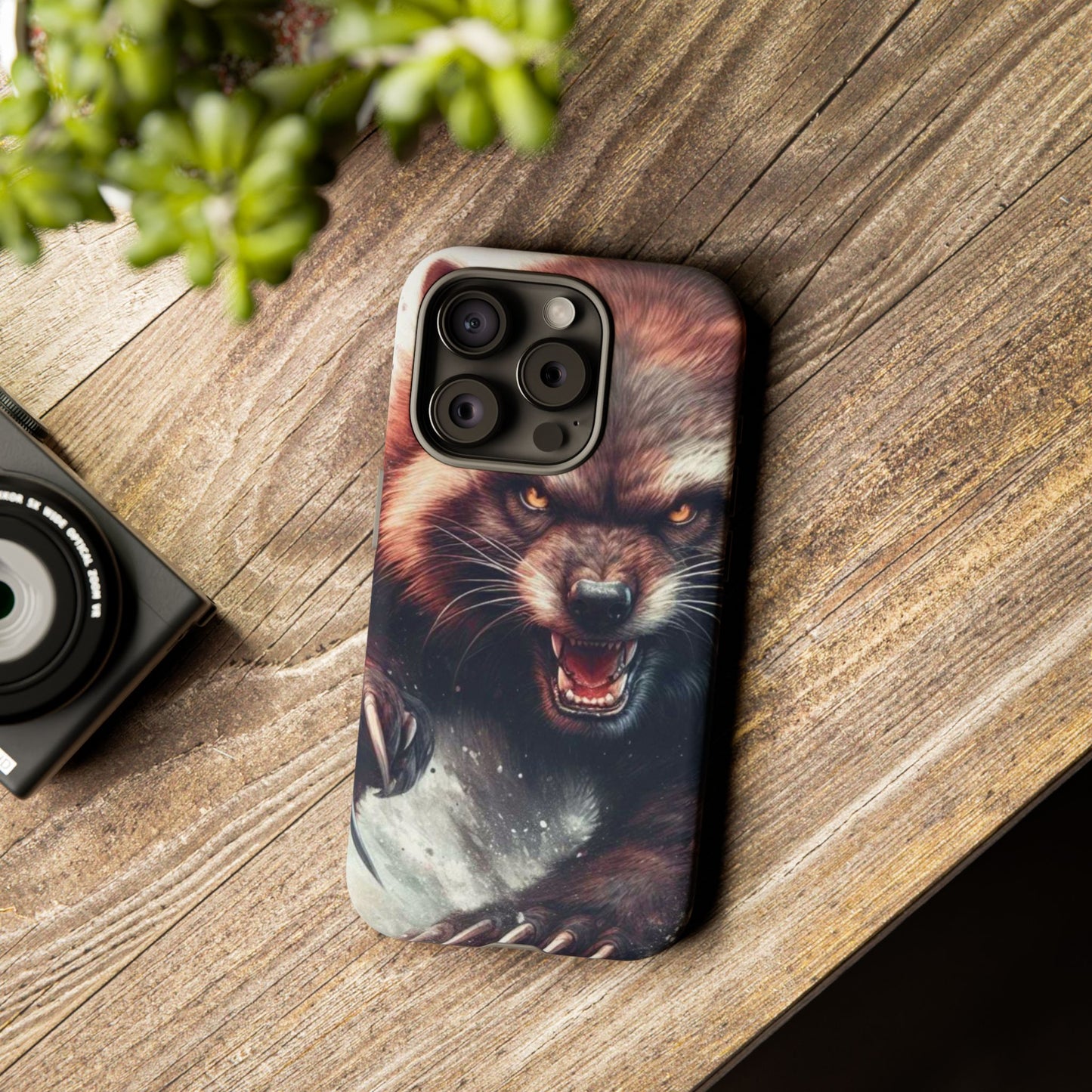 Wolverine snarling with claws out on a phone case.