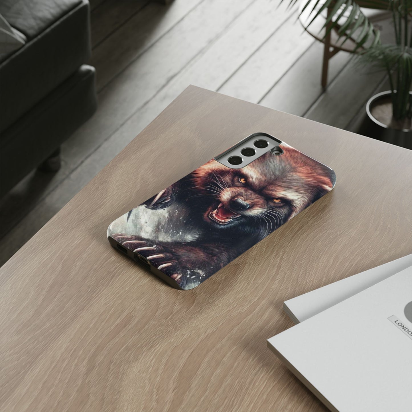 Wolverine snarling with claws out on a phone case.