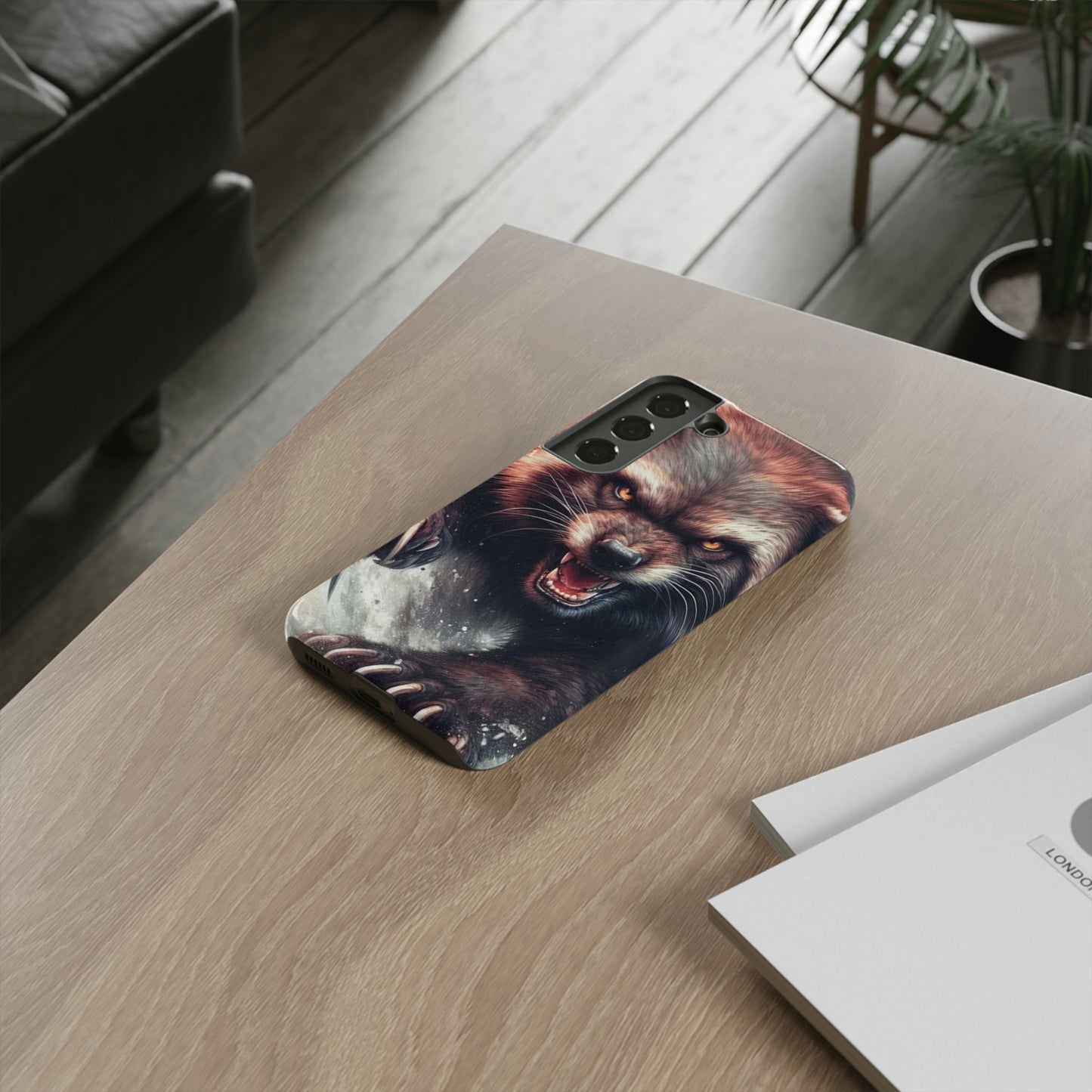 Wolverine snarling with claws out on a phone case.