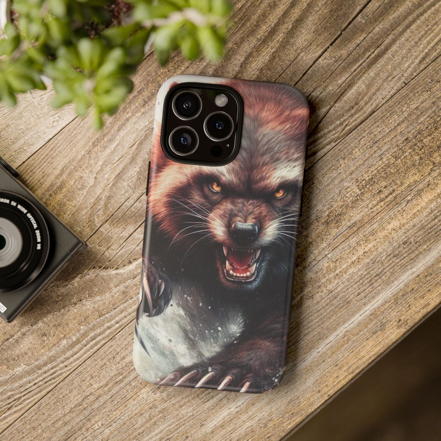 Wolverine snarling with claws out on a phone case.